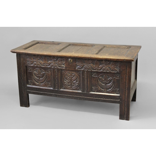 1728 - A LATE 17TH CENTURY WEST COUNTRY OAK COFFER, with a three panel lid with pin hinges, the front with ... 