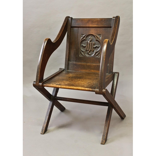 1733 - AN OAK GLASTONBURY STYLE ARM CHAIR, with solid seat and back, the back carved with initials 'ihs' wi... 