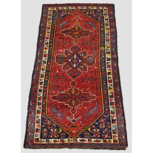 1888 - SEYCHOUR RUG,  East Caucasus, circa 1910. The brick red elongated lozenge field of tribal and zoomor... 