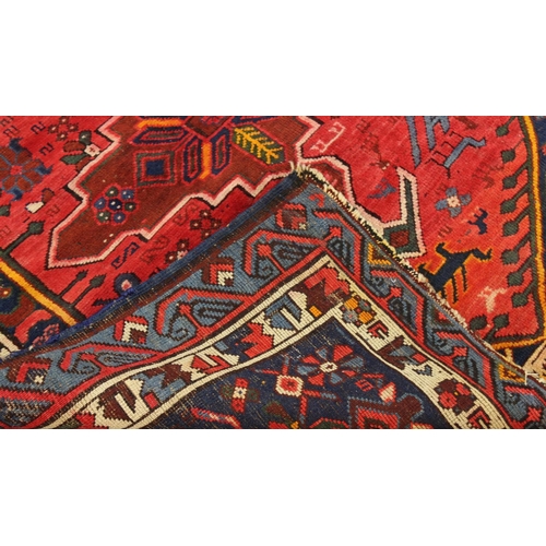 1888 - SEYCHOUR RUG,  East Caucasus, circa 1910. The brick red elongated lozenge field of tribal and zoomor... 