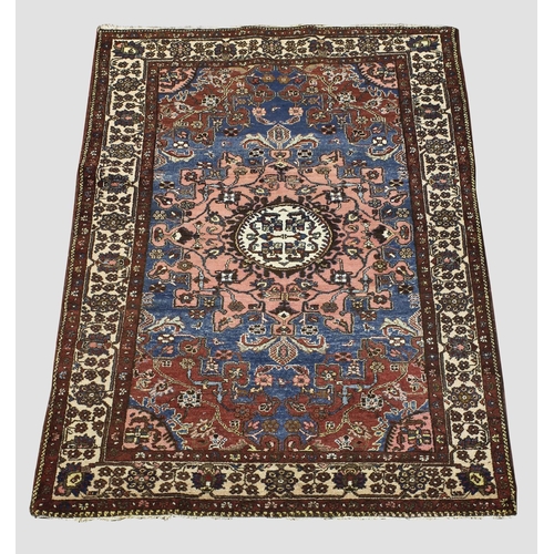 1892 - TAFRESH RUG,  Iranian Kurdistan, circa 1925. The sky blue field centred by a cream and salmon pink m... 