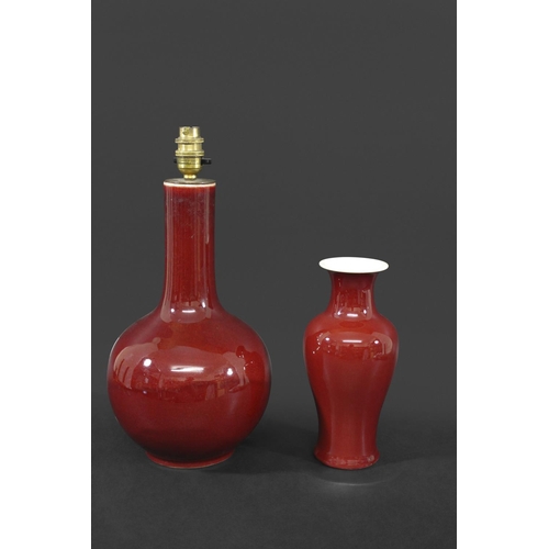 1260 - CHINESE SANG DE BOEUF VASE a porcelain baluster vase with an ox blood red glaze, unmarked (24cms hig... 