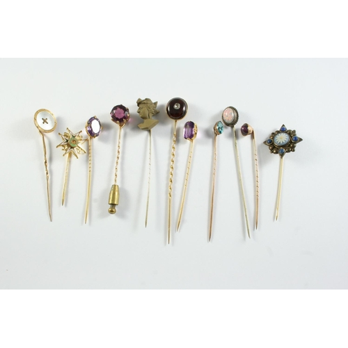 680 - FORTY TWO ASSORTED STICK PINS a carved lava cameo stick pin, depiciting the bust of a lady, a gold s... 