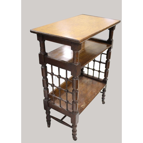 1028 - LIBERTY & CO SIDE TABLE An oak three tier table of Moorish influence, with a rectangular flat top an... 