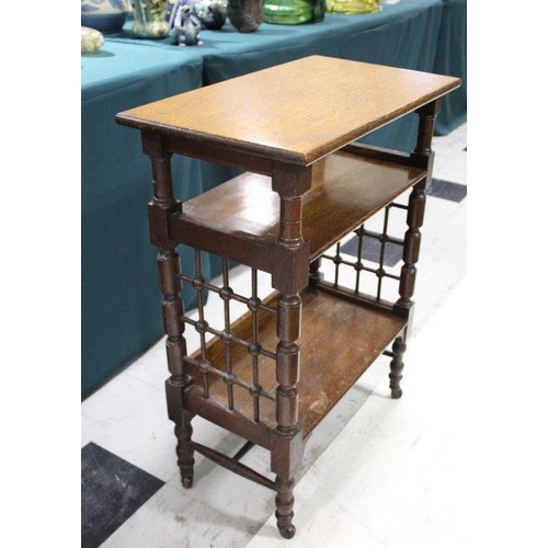 1028 - LIBERTY & CO SIDE TABLE An oak three tier table of Moorish influence, with a rectangular flat top an... 