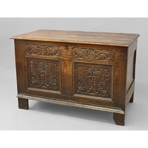 1730 - A 17TH CENTURY OAK COFFER WITH TWO PANEL FRONT, with a three plank top with moulded border on origin... 