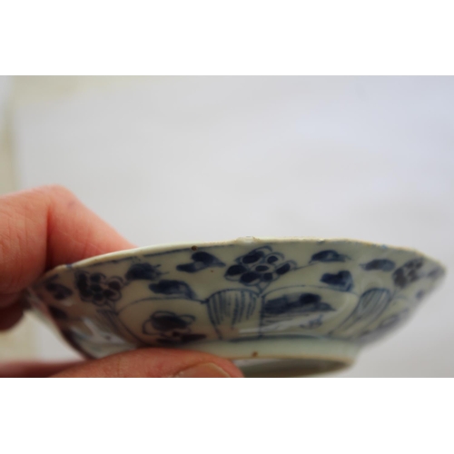 1257 - CHINESE BLUE & WHITE SAUCER a small blue and white saucer painted with various figures including one... 