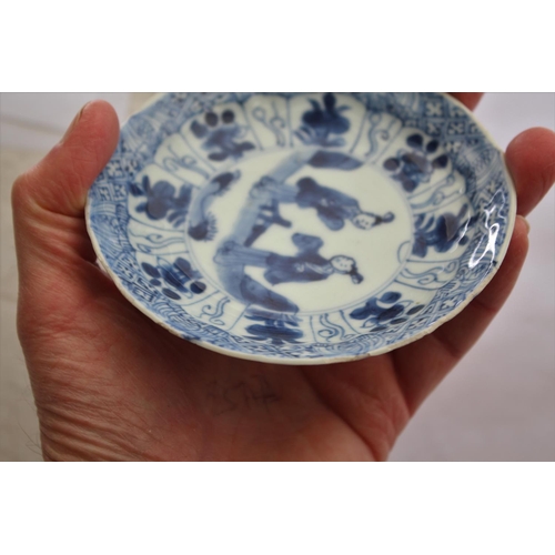 1257 - CHINESE BLUE & WHITE SAUCER a small blue and white saucer painted with various figures including one... 