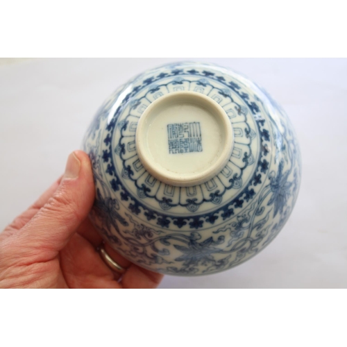 1257 - CHINESE BLUE & WHITE SAUCER a small blue and white saucer painted with various figures including one... 