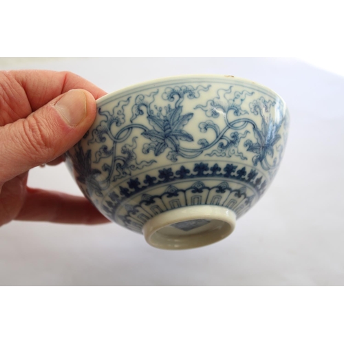 1257 - CHINESE BLUE & WHITE SAUCER a small blue and white saucer painted with various figures including one... 