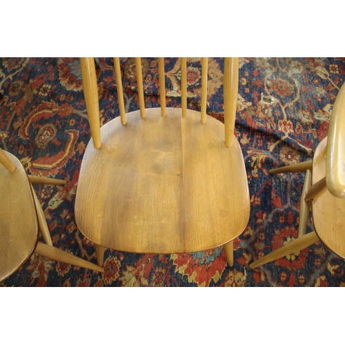 1007 - ERCOL DINING CHAIRS a set of four vintage light elm and beech stick back chairs (two carvers and two... 