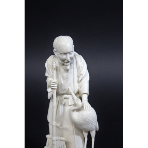 1265 - IVORY OKIMONO OF AN ELDERLY MAN & CRANE - SIGNED
a Meiji period figure of a bearded gentleman, sligh... 