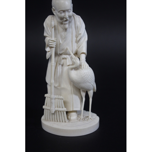 1265 - IVORY OKIMONO OF AN ELDERLY MAN & CRANE - SIGNED
a Meiji period figure of a bearded gentleman, sligh... 