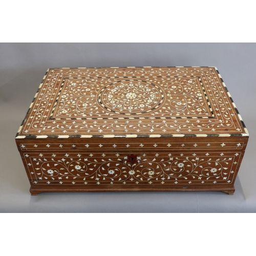 1705 - AN INDIAN INLAID SANDALWOOD BOX.
The rectangular lid inlaid with ebony and ivory or bone in radiatin... 