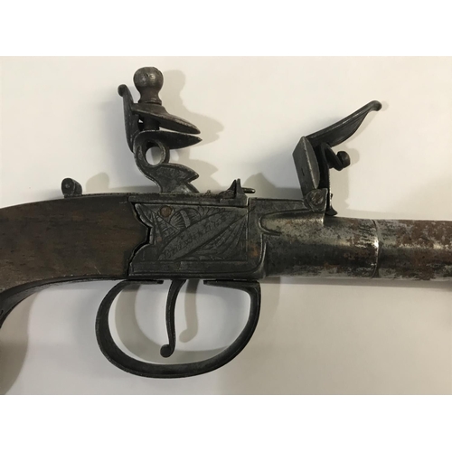 310 - A SCOTTISH FLINTLOCK POCKET PISTOL. With a round 6cm screw off barrel with underslung sprung bayonet... 