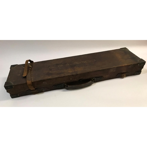 379 - A BRASS AND LEATHER GUN CASE FROM RIGBY AND CO. A case for a single gun with 30in barrels, with red ... 