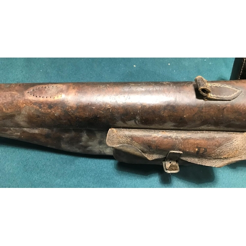 386 - A LEATHER 'LEG OF MUTTON' GUN CASE. A brown leather 'Leg of Mutton' gun case with side pouch painted... 