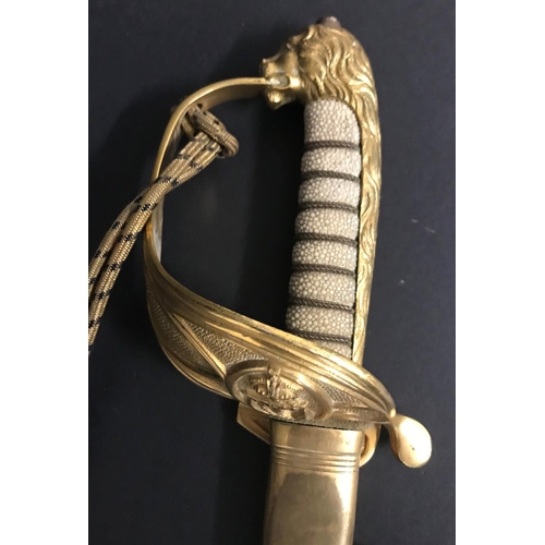 404 - AN 1827 PATTERN NAVL OFFICERS SWORD AND SCABBARD. An Elizabeth II Naval Officers sword with unmarked... 