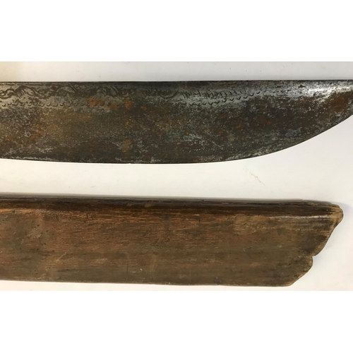 431 - A BORNEO HEAD HUNTERS SWORD AND SCABBARD. A Dyack type sword and scabbard, the curving 53cm one side... 