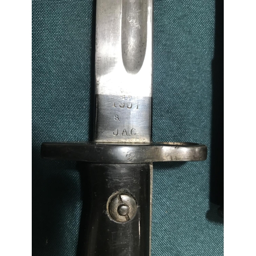 438 - A BRITISH 1907 PATTERN BAYONET AND SCABBARD. A 1907 Pattern bayonet with a 43cm fullered blade stamp... 