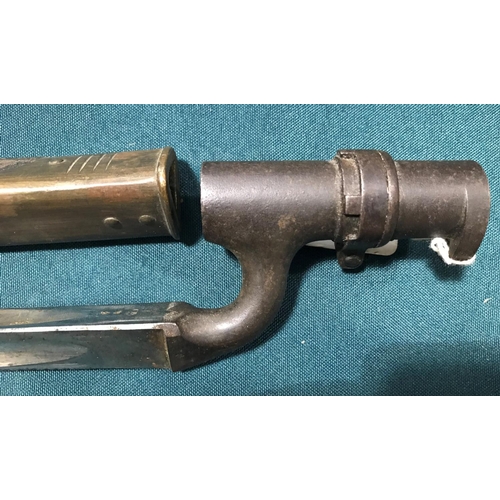 439 - AN 1876 PATTERN BAYONET AND SCABBARD.  A British 1876 Pattern Socket Bayonet with a 55cm triangular ... 