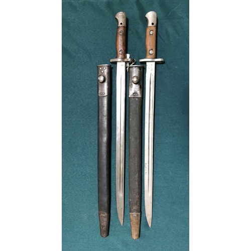 444 - TWO 1907 PATTERN BAYONETS AND SCABBARDS. A Vickers 1907 Pattern bayonet with a 43.5cm pointed fuller... 