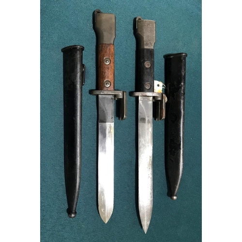 448 - TWO BELGIAN MADE BAYONETS AND SCABBARDS FOR THE FN RILE.  A Belgian made F.N. Bayonet with a 19.7cm ... 