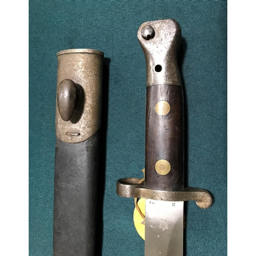 450 - A VICTORIAN 1888 PATTERN BAYONET AND SCABBARD.  An 1888 pattern bayonet with a 30cm double edged poi... 