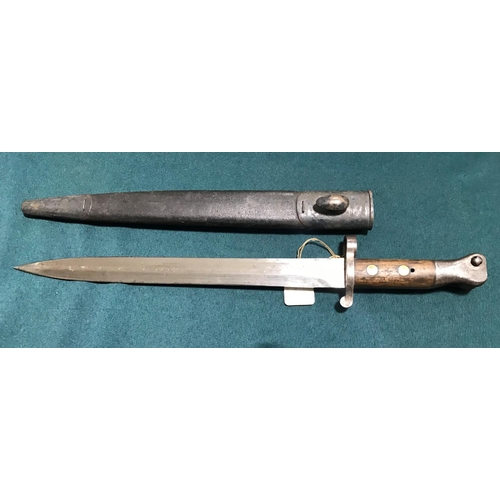 452 - A VICTORIAN 1888 PATTERN BAYONET AND SCABBARD BY WILKINSON.  An 1888 pattern bayonet with a 30.5cm d... 