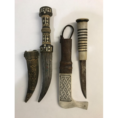 480 - A COLLECTION OF SEVEN EASTERN AND INDIAN KNIVES. An unusual bone handled knife with banded grip and ... 