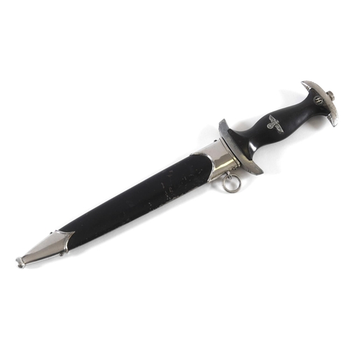 485 - A MODEL 33 TYPE SS DAGGER AND SCABBARD BY RZM. The 22cm pointed blade with SS legend 'Your Honour Is... 