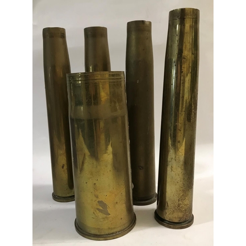A COLLECTION OF BRASS SHELL CASINGS. A 76mm ARMD shell casing dated 1957,  three 40mm casings dated 1