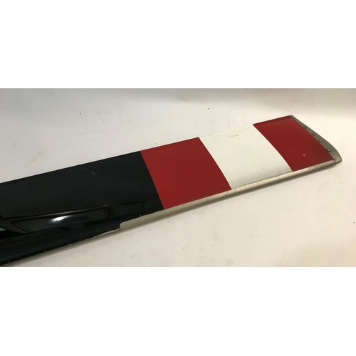 676 - A SEA KING HELICOPTER ROTOR BLADE. A tail rotor blade from a Sea King Helicopter, finished in black ... 