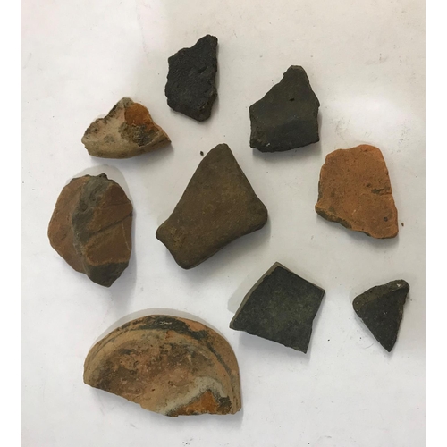 911 - ROMAN AND OTHER POTTERY FIELD FINDS. Ten pieces of pottery, Roman and similar, field finds.