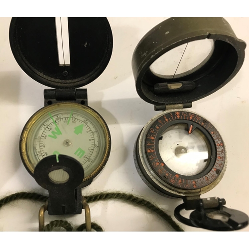 667 - A MEDIUM LANDING COMPASS AND OTHERS. A Medium Landing Compass No. 1122KHI/54, two second world war c... 