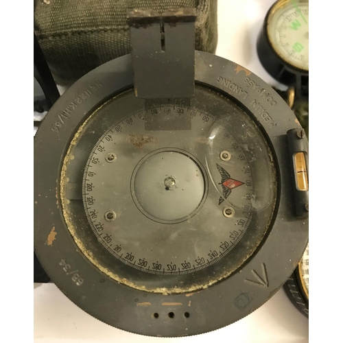 667 - A MEDIUM LANDING COMPASS AND OTHERS. A Medium Landing Compass No. 1122KHI/54, two second world war c... 