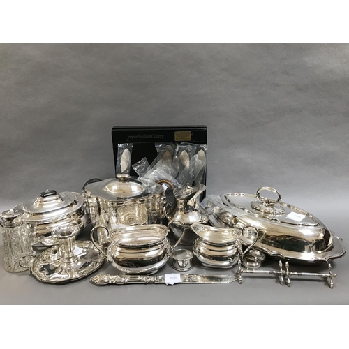 21 - Quantity of Silver Plated Items to include Entree Dish, Three Piece Teaset and Two Silver Napkin Rin... 