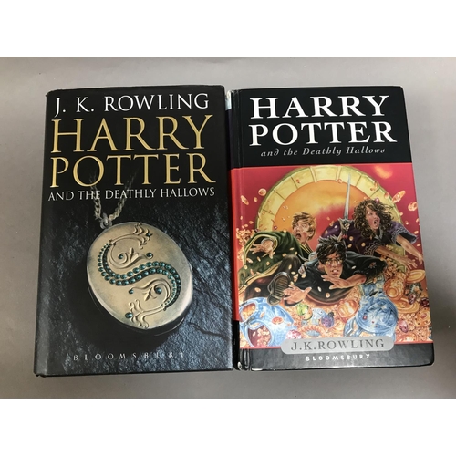 123 - Two Harry Pottery Books, first editions of the Deathly Hallows (one hard back, ex library)