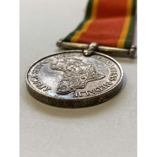 1004 - A SECOND WORLD WAR AFRICA SERVICE MEDAL AND GERMAN  EASTERN WINTER MEDAL. An Africa Service Medal 19... 