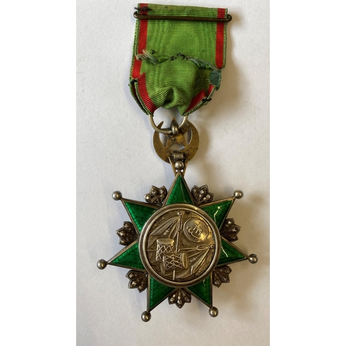 1011 - THE TURKISH ORDER OF OSMANIEH. A Turkish Empire Order of Osmanieh breast award on green and red ribb... 