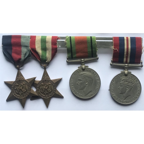 1036 - A SELECTION OF SECOND WORLD WAR MEDALS. A Second World War group of four comprising 1939/1945 and Bu... 