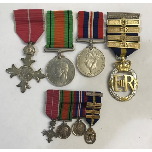 1038 - A SECOND WORLD WAR MBE GROUP OF FOUR AND MINIATURES.
A group of four comprising MBE on military ribb... 