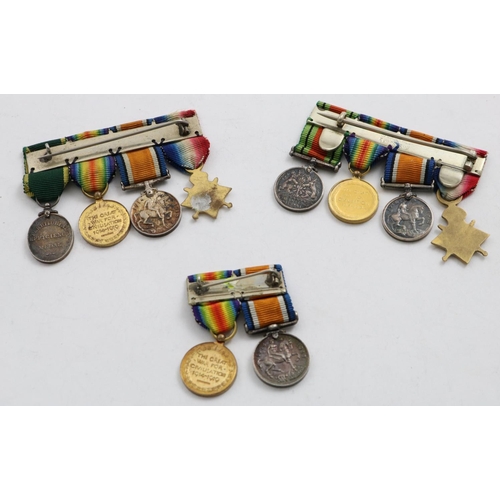 1040 - THREE GROUPS OF FIRST WORLD WAR MINIATURES. A group of four miniatures comprising Great War trio and... 