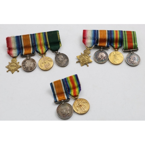 1040 - THREE GROUPS OF FIRST WORLD WAR MINIATURES. A group of four miniatures comprising Great War trio and... 