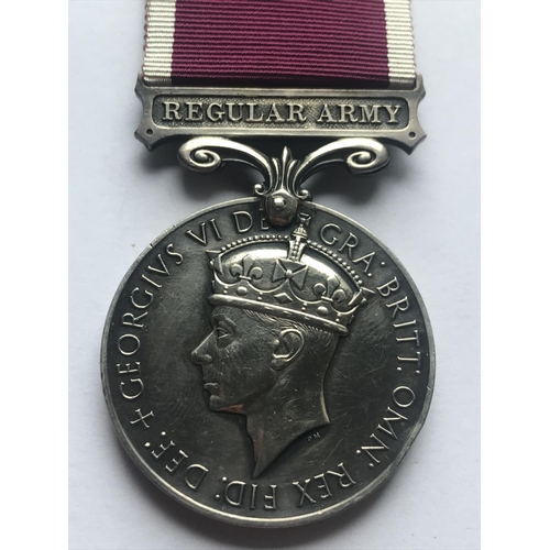 1045 - A GEORGE VI LONG SERVICE AND GOOD CONDUCT MEDAL. A George VI Long Service and Good Conduct medal wit... 