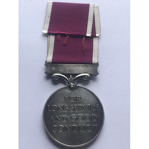 1045 - A GEORGE VI LONG SERVICE AND GOOD CONDUCT MEDAL. A George VI Long Service and Good Conduct medal wit... 