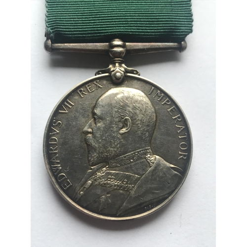 1049 - AN EDWARD VII VOLUNTEER FORCE LONG SERVICE AWARD. An Edward VII Volunteer Force Long Service award n... 