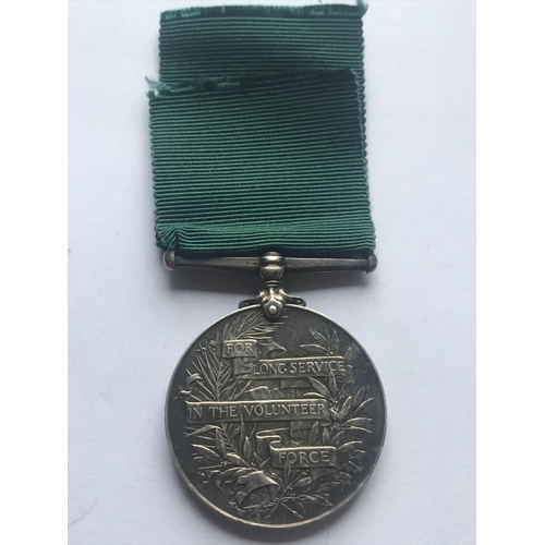 1049 - AN EDWARD VII VOLUNTEER FORCE LONG SERVICE AWARD. An Edward VII Volunteer Force Long Service award n... 