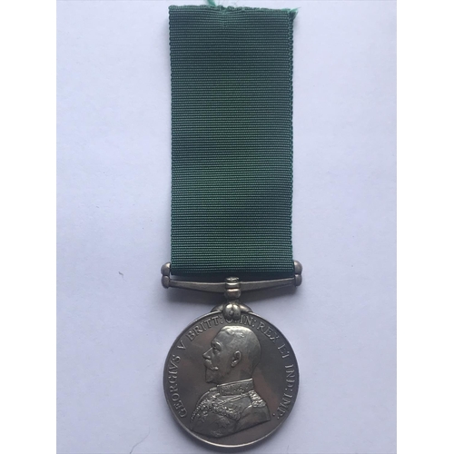 1050 - A GEORGE V VOLUNTEER FORCE LONG SERVICE AWARD. A George V Volunteer Force Long Service award with en... 