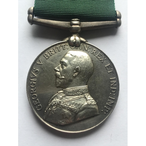 1050 - A GEORGE V VOLUNTEER FORCE LONG SERVICE AWARD. A George V Volunteer Force Long Service award with en... 